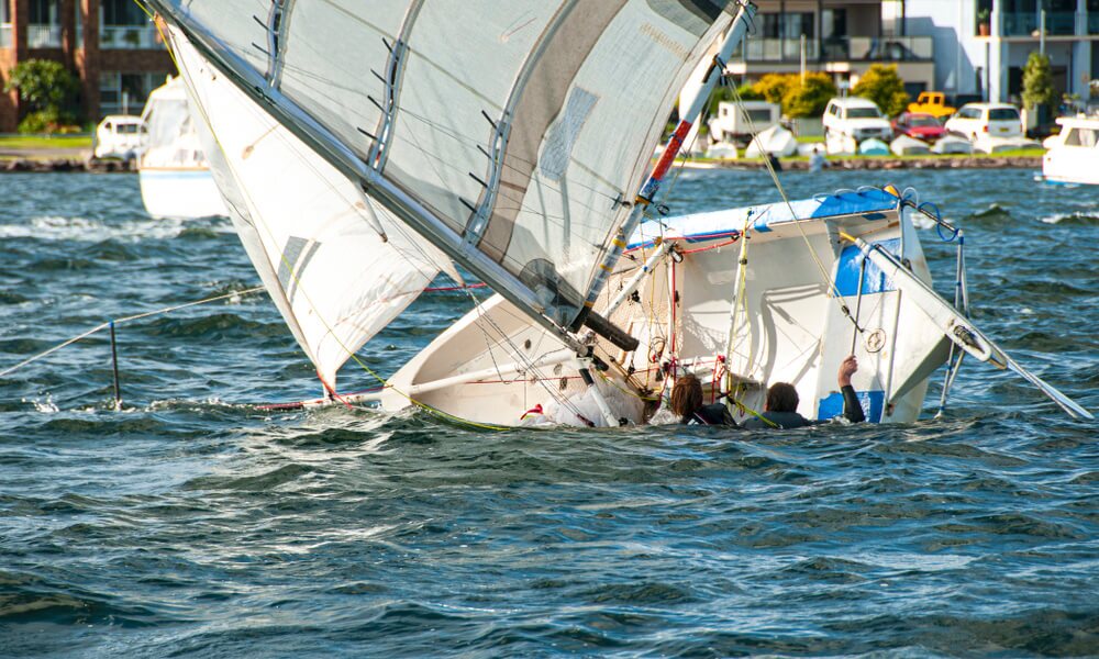 Sailboat sinking due to accident.