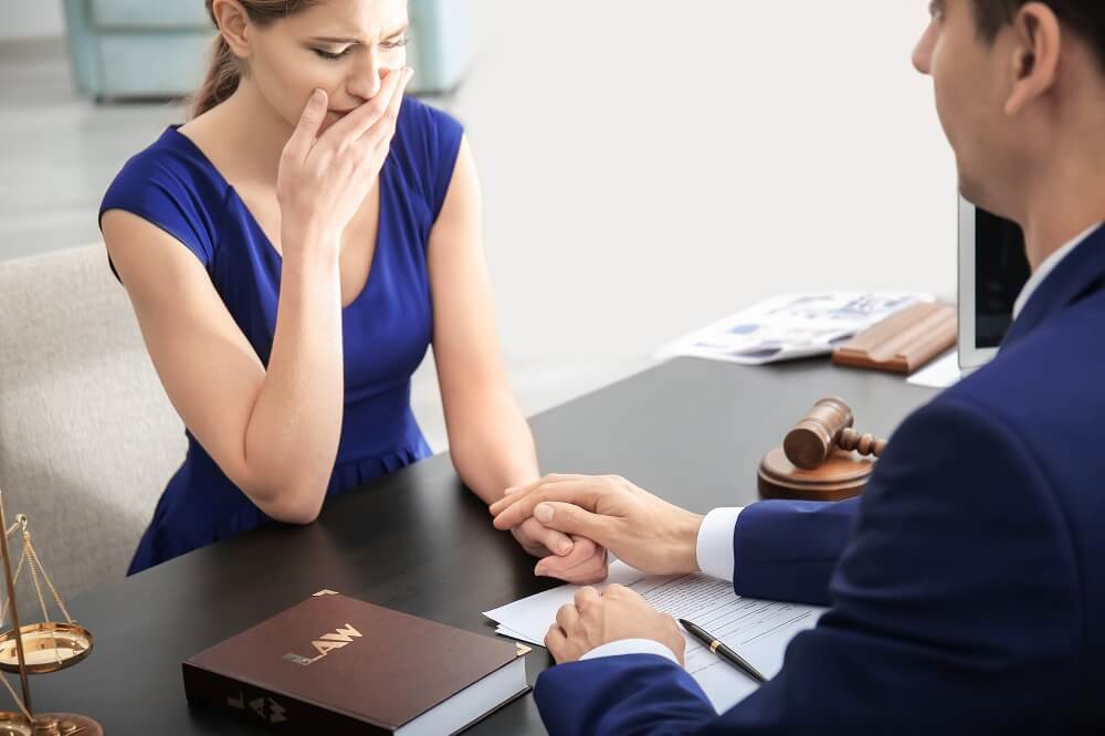 Widow consulting wrongful death lawyer.