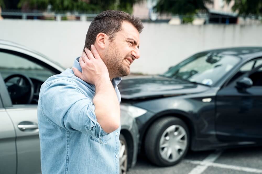 One man suffering pain after car crash injury.