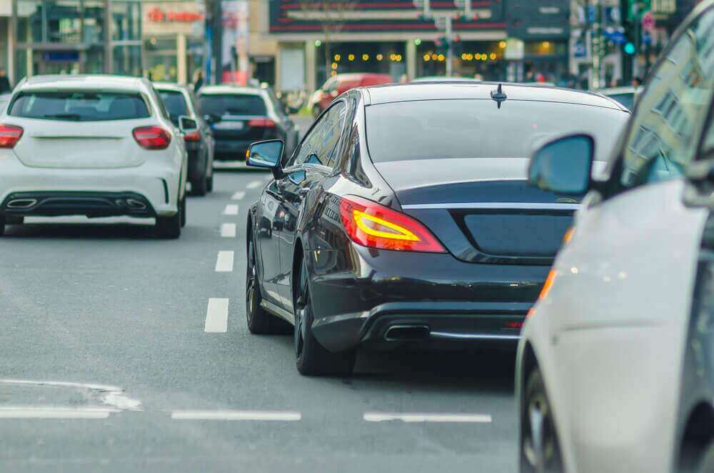 Black car changing lane.