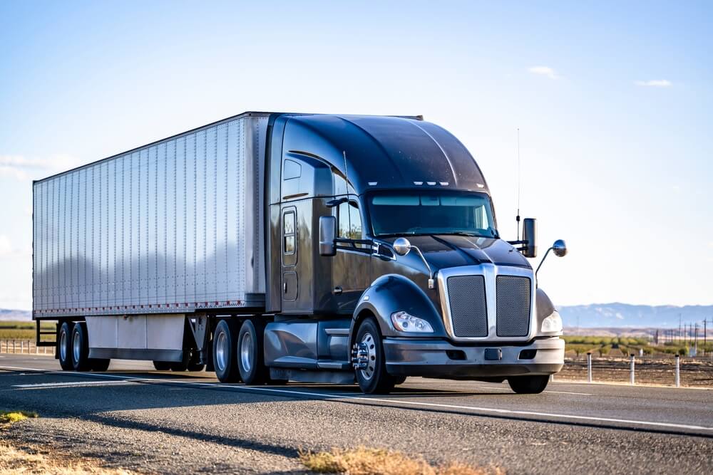 Similar like amazon truck passing road.