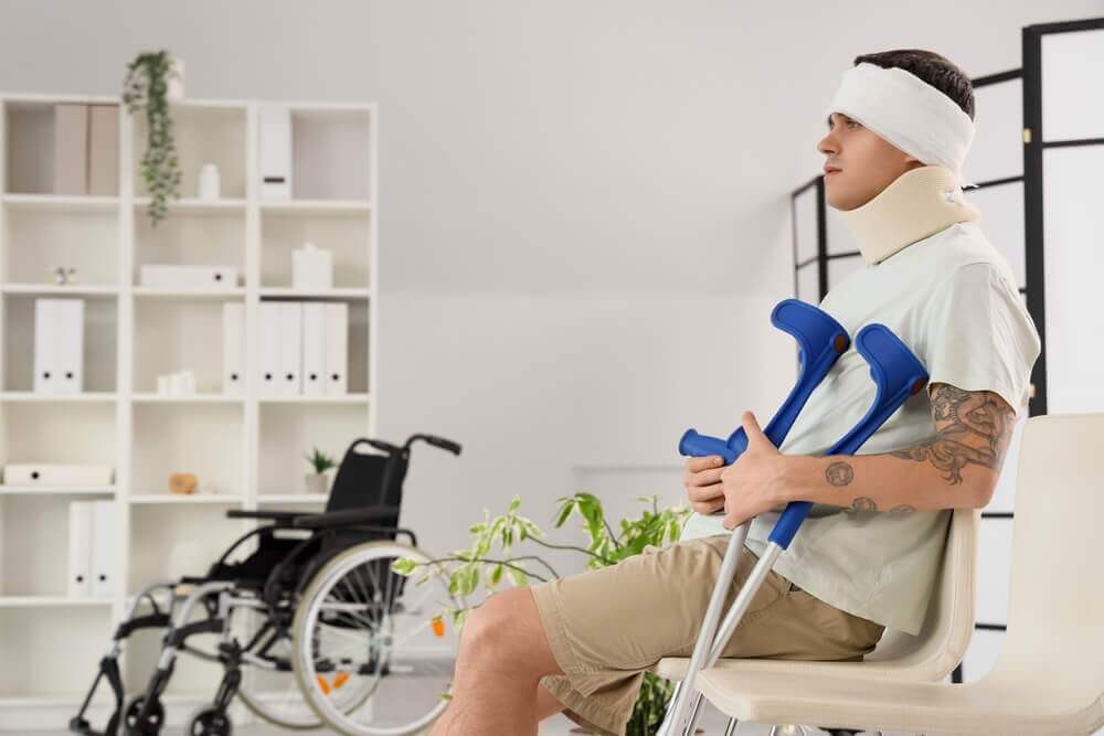 Injured car accident victim on crutches.