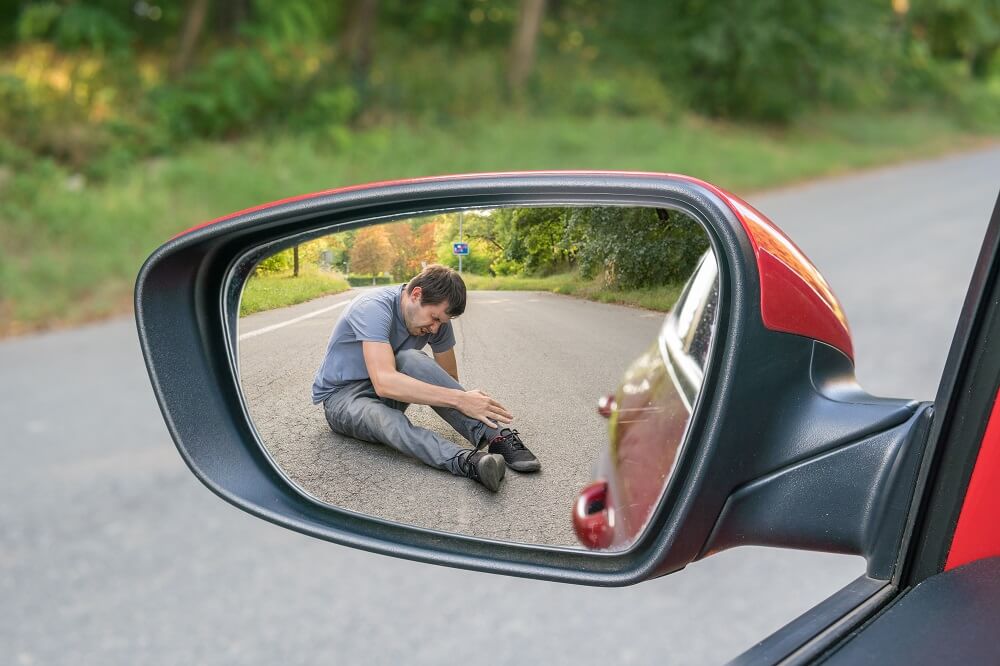 Side mirror view from hit and run accident.